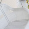 White Resin Wicker Porch Swing with Hanging Chain - 600-lb Weight Capacity - Image 2